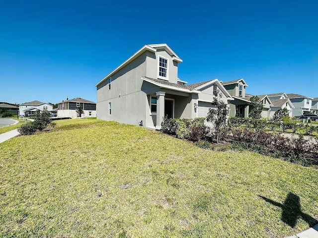 2807 Alder Berry Blvd, Ocoee, FL 34761 - view of side of property with stucco siding, a lawn, and a residential view