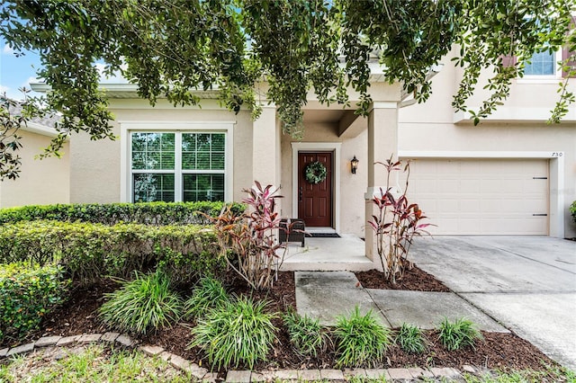 750 Maple Leaf Loop, Winter Springs, FL 32708 - view of front facade with stucco siding, driveway, and a garage