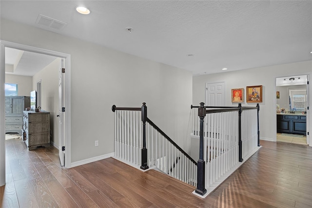 750 Maple Leaf Loop, Winter Springs, FL 32708 - hallway with an upstairs landing, wood finished floors, recessed lighting, and baseboards