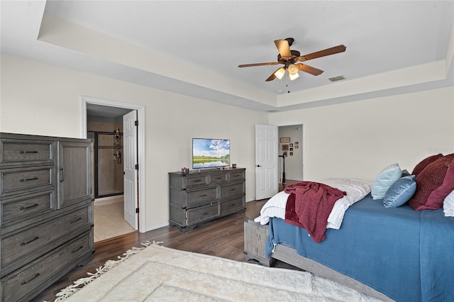 750 Maple Leaf Loop, Winter Springs, FL 32708 - bedroom with dark wood-type flooring, a raised ceiling, and ensuite bathroom