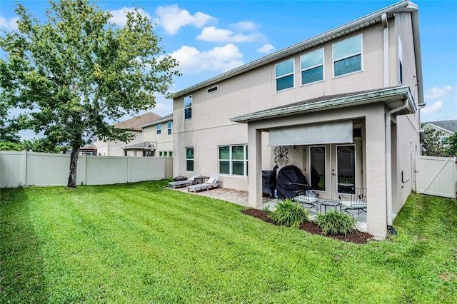 750 Maple Leaf Loop, Winter Springs, FL 32708 - rear view of property with stucco siding, a patio area, french doors, and a gate