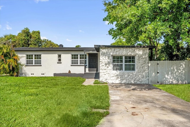 906 Kensington Dr, Orlando, FL 32808 - ranch-style home with stone siding and stucco siding