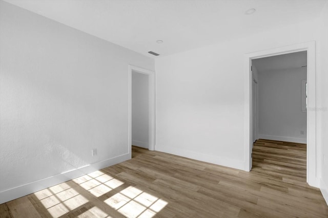 906 Kensington Dr, Orlando, FL 32808 - unfurnished room featuring wood finished floors and baseboards