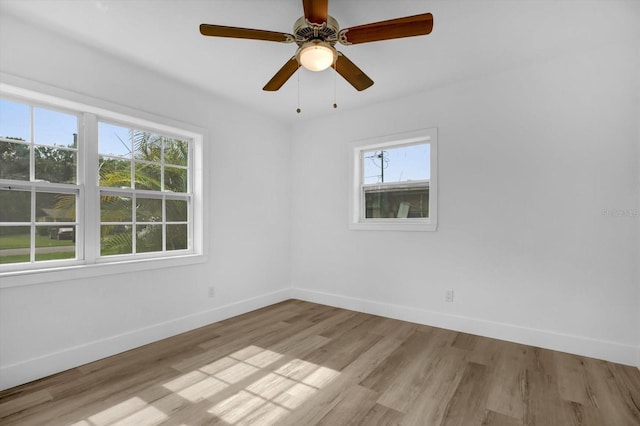 906 Kensington Dr, Orlando, FL 32808 - empty room featuring baseboards, light wood-style floors, and ceiling fan