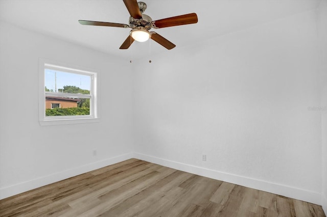 906 Kensington Dr, Orlando, FL 32808 - empty room with baseboards, light wood-style flooring, and a ceiling fan