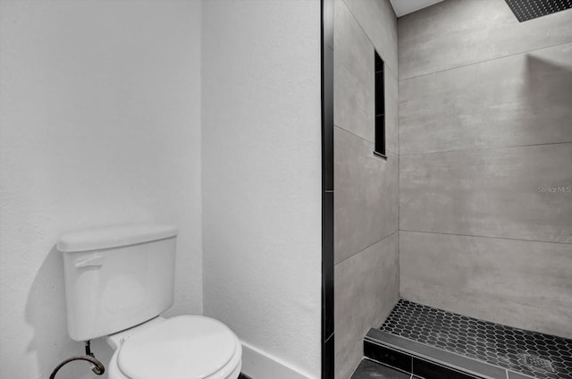 906 Kensington Dr, Orlando, FL 32808 - bathroom with tiled shower and toilet
