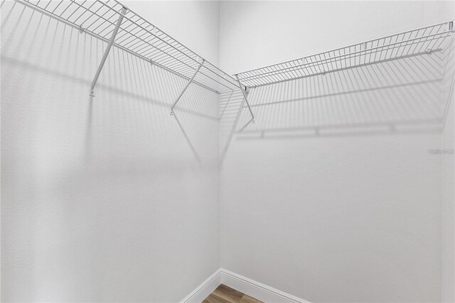 16730 SW 50th Cir, Ocala, FL 34473 - spacious closet featuring wood finished floors