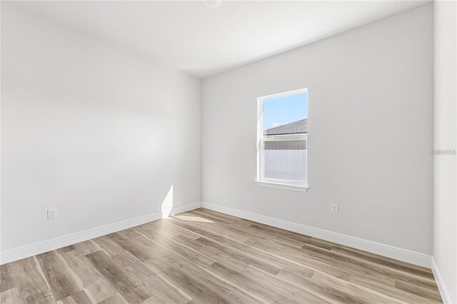 16730 SW 50th Cir, Ocala, FL 34473 - unfurnished room with light wood-style flooring and baseboards
