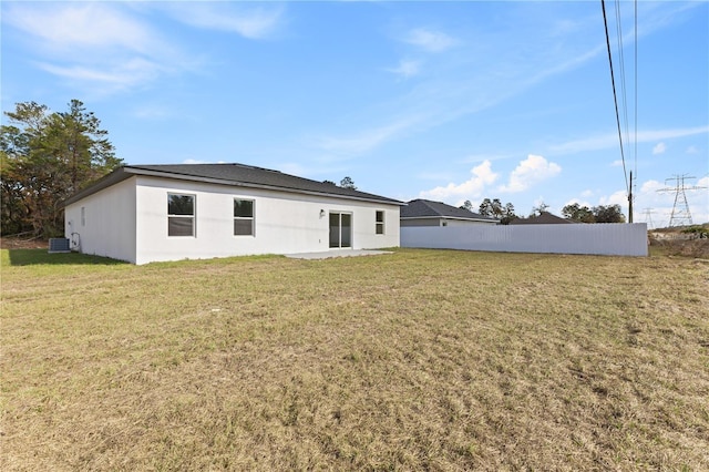 16730 SW 50th Cir, Ocala, FL 34473 - rear view of house featuring central AC unit and stucco siding