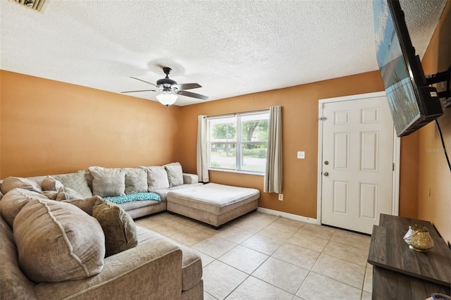 6663 NW 60th St, Ocala, FL 34482 - living area with a ceiling fan, light tile patterned flooring, a textured ceiling, and baseboards