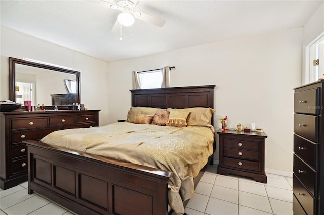 6663 NW 60th St, Ocala, FL 34482 - bedroom featuring light tile patterned floors and a ceiling fan