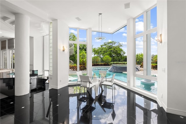 9138 Great Heron Cir, Orlando, FL 32836 - dining area featuring healthy amount of natural light and floor to ceiling windows