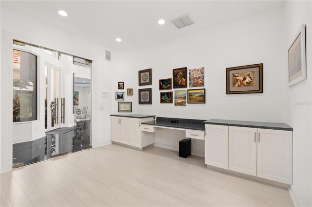9138 Great Heron Cir, Orlando, FL 32836 - office featuring light wood finished floors, recessed lighting, and built in desk