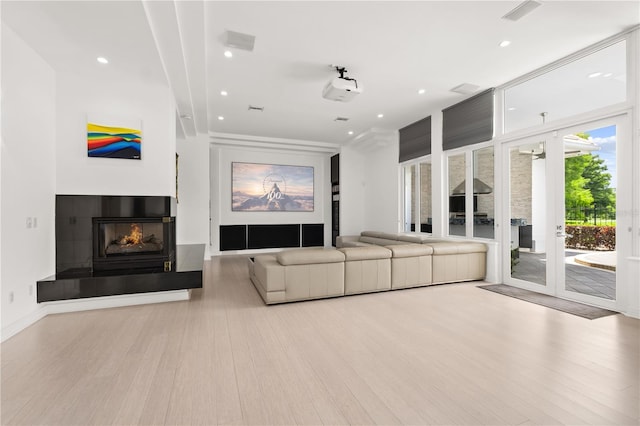 9138 Great Heron Cir, Orlando, FL 32836 - unfurnished living room featuring wood finished floors, recessed lighting, and a multi sided fireplace
