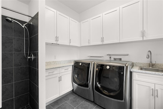 9138 Great Heron Cir, Orlando, FL 32836 - laundry room with separate washer and dryer, cabinet space, and dark tile patterned flooring