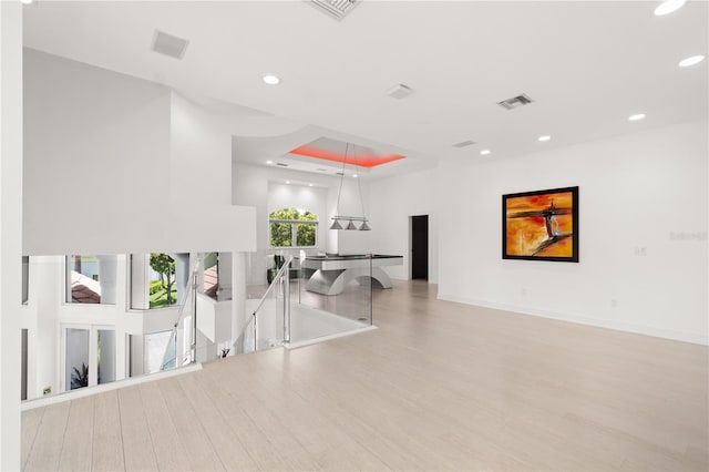 9138 Great Heron Cir, Orlando, FL 32836 - spare room with wood finished floors, recessed lighting, and a tray ceiling