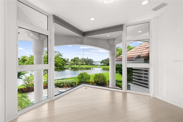 9138 Great Heron Cir, Orlando, FL 32836 - unfurnished sunroom with a water view