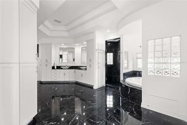 9138 Great Heron Cir, Orlando, FL 32836 - bathroom with a garden tub, a shower stall, vanity, and a tray ceiling