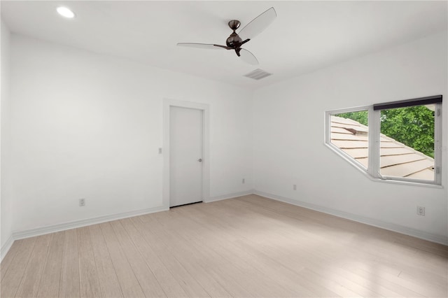 9138 Great Heron Cir, Orlando, FL 32836 - empty room with light wood-style floors, ceiling fan, and recessed lighting