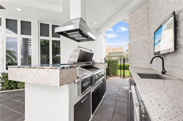 9138 Great Heron Cir, Orlando, FL 32836 - kitchen featuring island range hood, light stone countertops, recessed lighting, dark tile patterned floors, and dark cabinetry