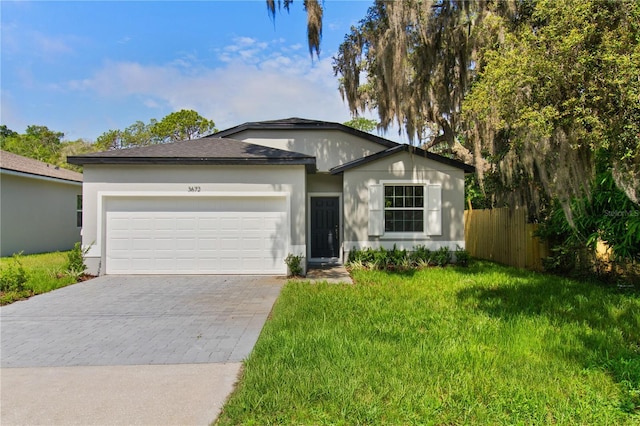 3672 Rollin O Ln, Apopka, FL 32703 - ranch-style house featuring decorative driveway, an attached garage, and stucco siding