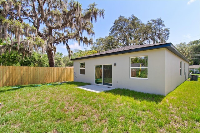 3672 Rollin O Ln, Apopka, FL 32703 - back of house featuring stucco siding, a patio area, and central AC unit