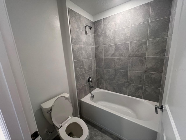 930 Cattleman St, Winter Haven, FL 33881 - bathroom with toilet, washtub / shower combination, and tile patterned floors
