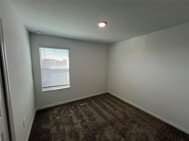 930 Cattleman St, Winter Haven, FL 33881 - spare room with dark carpet and baseboards