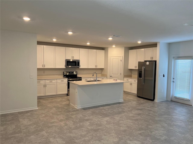 930 Cattleman St, Winter Haven, FL 33881 - kitchen featuring stainless steel appliances, a sink, white cabinetry, baseboards, and recessed lighting