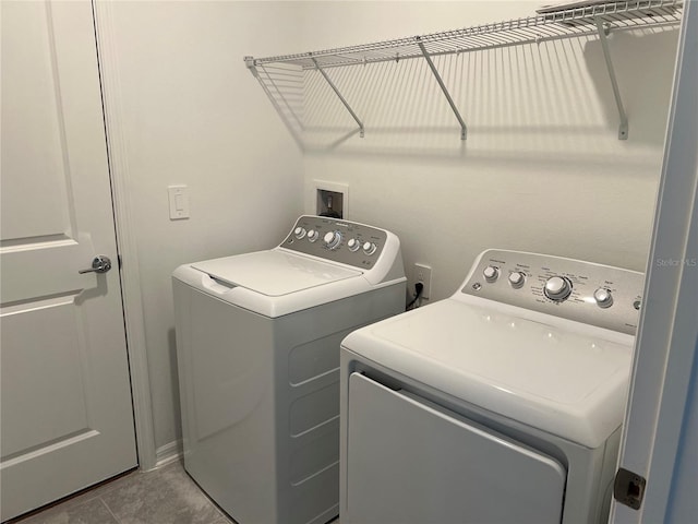 930 Cattleman St, Winter Haven, FL 33881 - washroom featuring independent washer and dryer and tile patterned floors