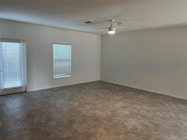 930 Cattleman St, Winter Haven, FL 33881 - unfurnished room featuring ceiling fan, healthy amount of natural light, and baseboards