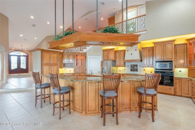 1175 Tuckaway Dr, Rockledge, FL 32955 - kitchen featuring stainless steel appliances, high vaulted ceiling, backsplash, light tile patterned floors, and light stone counters