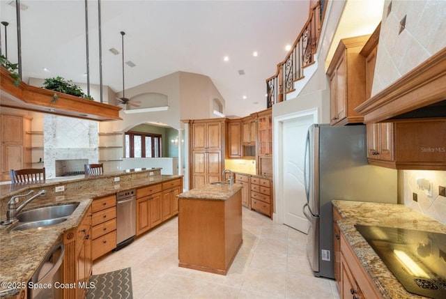 1175 Tuckaway Dr, Rockledge, FL 32955 - kitchen featuring a sink, a kitchen island with sink, custom exhaust hood, backsplash, and ceiling fan