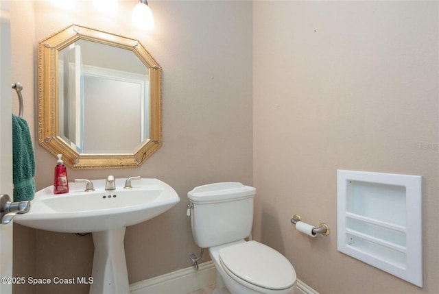 1175 Tuckaway Dr, Rockledge, FL 32955 - bathroom with toilet and baseboards