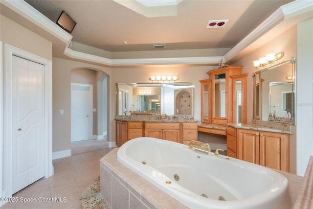 1175 Tuckaway Dr, Rockledge, FL 32955 - full bathroom with a whirlpool tub, vanity, tile patterned floors, and baseboards