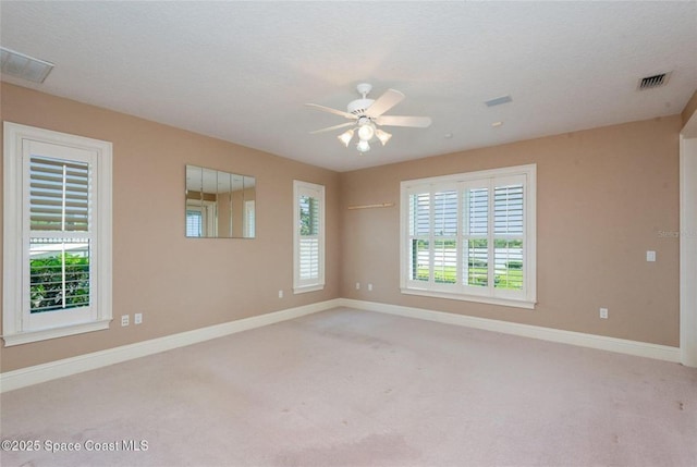 1175 Tuckaway Dr, Rockledge, FL 32955 - spare room featuring carpet flooring, baseboards, and a ceiling fan
