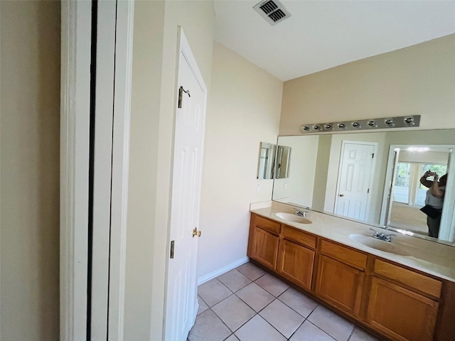 830 Moonlit Ln, Casselberry, FL 32707 - full bathroom featuring double vanity, tile patterned floors, and baseboards