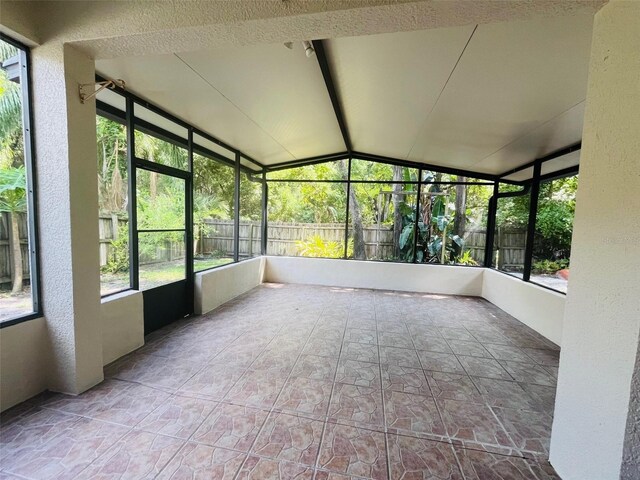 830 Moonlit Ln, Casselberry, FL 32707 - unfurnished sunroom with vaulted ceiling and plenty of natural light