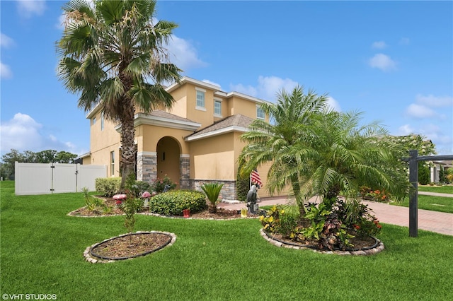 2659 Magpie Way, Sanford, FL 32773 - mediterranean / spanish-style home with stucco siding, stone siding, a gate, and decorative driveway