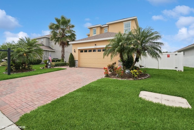 2659 Magpie Way, Sanford, FL 32773 - view of front of house with stucco siding, decorative driveway, and an attached garage