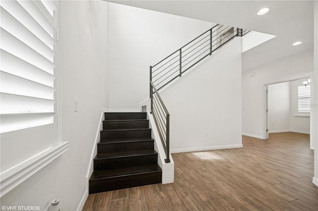 2659 Magpie Way, Sanford, FL 32773 - stairway featuring baseboards, wood finished floors, and recessed lighting
