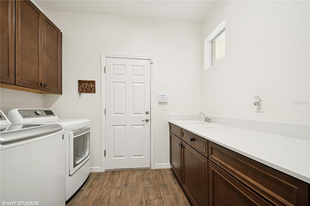 2659 Magpie Way, Sanford, FL 32773 - laundry room featuring washer and clothes dryer, dark wood finished floors, cabinet space, and baseboards