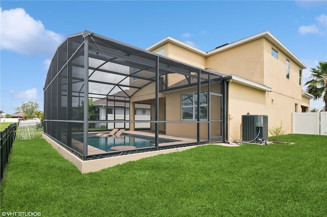 2659 Magpie Way, Sanford, FL 32773 - back of property featuring central air condition unit, stucco siding, a patio area, and a lanai