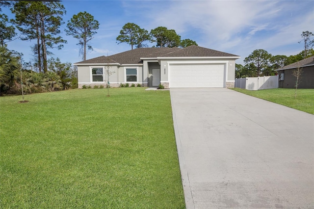 878 Reading St Unit 22, Palm Bay, FL 32909 - view of front facade with an attached garage, concrete driveway, stucco siding, and stone siding