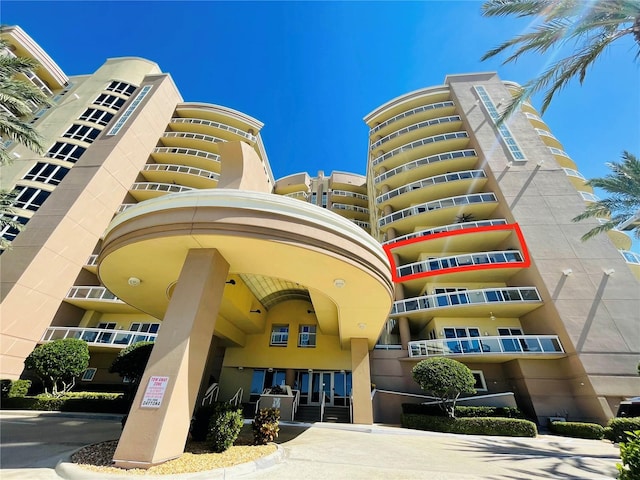1925 S Atlantic Ave Unit 411, Daytona Beach, FL 32118 - view of apartment building / complex