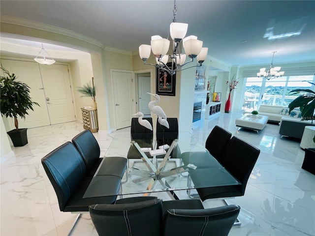 1925 S Atlantic Ave Unit 411, Daytona Beach, FL 32118 - dining area featuring a chandelier, light marble finish flooring, ornamental molding, and baseboards