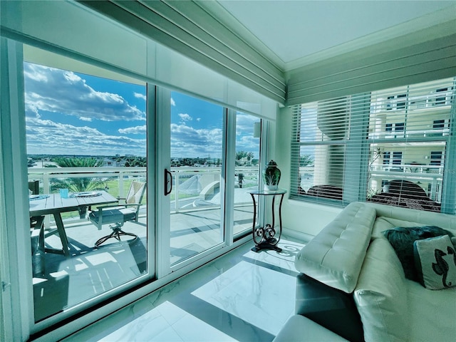 1925 S Atlantic Ave Unit 411, Daytona Beach, FL 32118 - bedroom with access to exterior, marble finish floors, and ornamental molding
