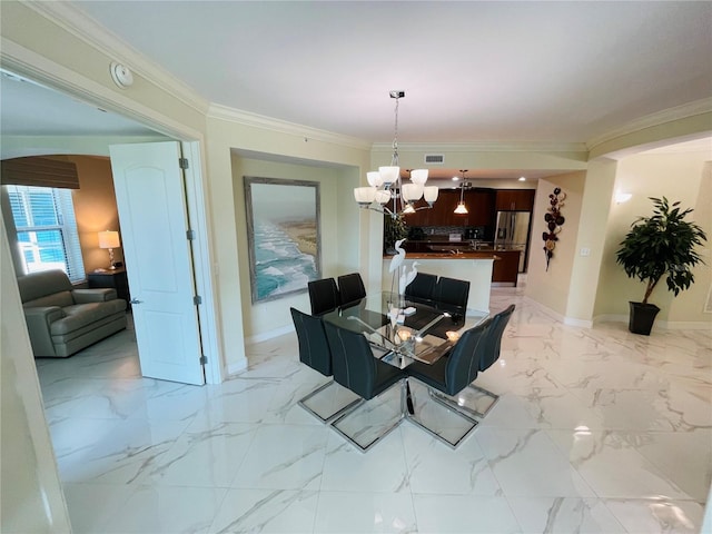 1925 S Atlantic Ave Unit 411, Daytona Beach, FL 32118 - dining area with a chandelier, baseboards, crown molding, and light marble finish floors