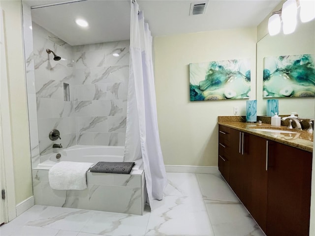 1925 S Atlantic Ave Unit 411, Daytona Beach, FL 32118 - full bath with marble look tiles, shower / bath combo, baseboards, vanity, and recessed lighting