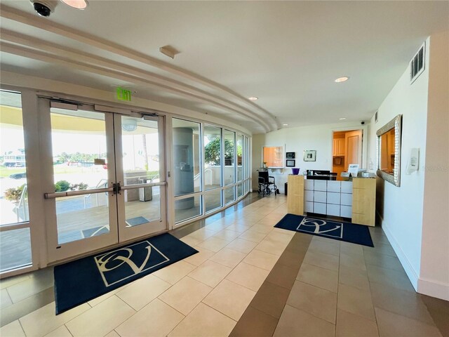 1925 S Atlantic Ave Unit 411, Daytona Beach, FL 32118 - welcome area featuring french doors and recessed lighting